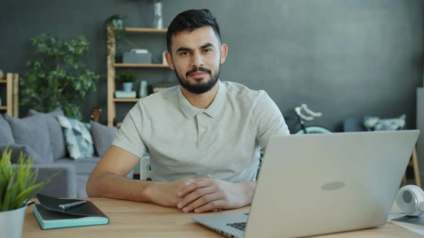 A professional at a desk with a laptop